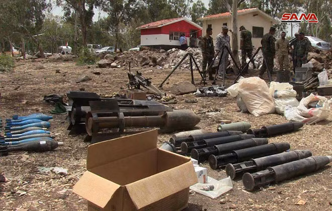 Quân đội Syria chiếm giữ lượng vũ khí khổng lồ của phe thánh chiến ở Homs ảnh 9