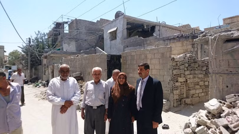 Trưởng lão và các thành viên của nhóm hòa giải dân tộc ở thị trấn Khan al- Shih