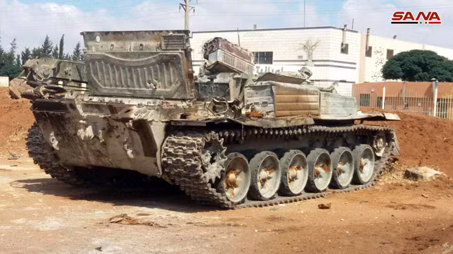 Lực lượng Hồi giáo cực đoan ở Daraa giao nộp vũ khí hạng nặng. Ảnh SANA