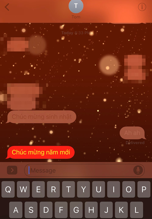 Hiệu ứng bắn pháo bông xuất hiện khi gõ cú pháp "Chúc mừng năm mới" qua iMessage trên iPhon