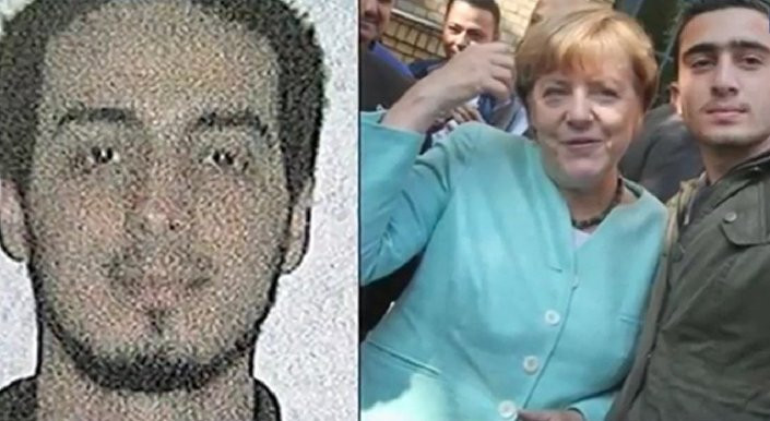 Bà Merkel chụp với người được cho là chiến binh đánh bom tự sát 