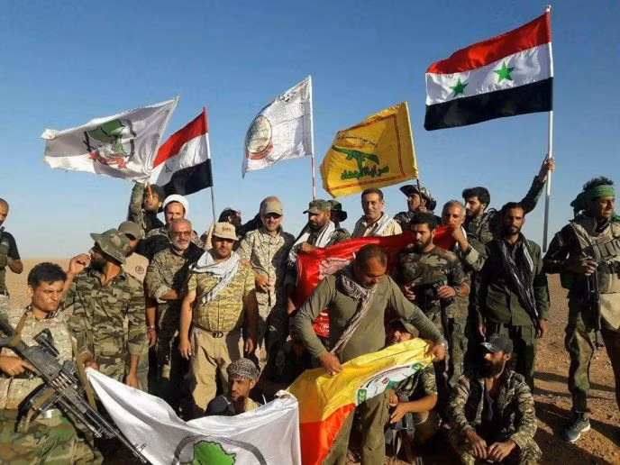 Lực lượng hỗn hợp quân đội Syria, PMU, Hezbollah trước cuộc tấn công vào thành phố Al-Bukamal - Deir Ezzor. Ảnh minh họa Masdar News
