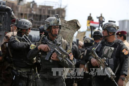 Lực lượng chống khủng bố Iraq tuần tra trên đường phố Tikrit sau khi thành phố được giải phóng. Ảnh: AFP/TTXVN