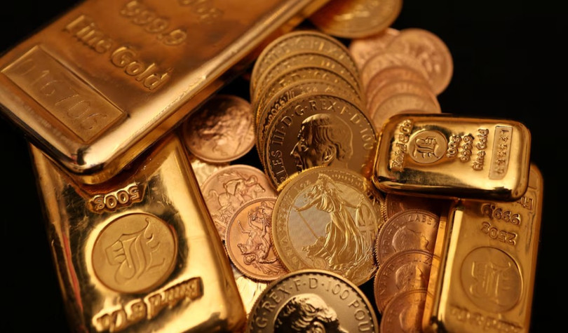Các thỏi vàng và đồng xu vàng của Anh được trưng bày tại cửa hàng Baird & Co ở Hatton Garden, London, Anh ngày 8/10/2025. Ảnh: Reuters.
