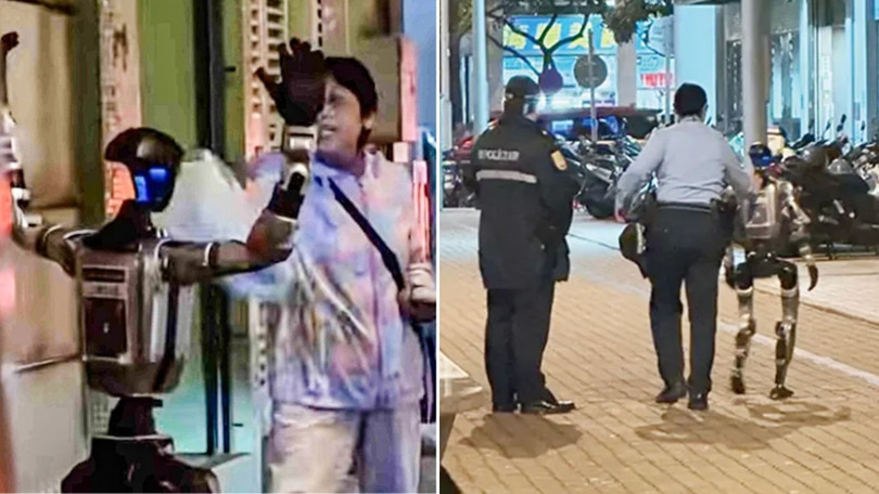 Một người máy hình người được cảnh sát hộ tống trên đường phố Macau, Trung Quốc. Ảnh: IE.