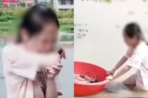 Người cha bắt cô con gái đào củ sen giữa trưa nắng gắt để dạy con về giá trị giáo dục (Ảnh: SCMP)