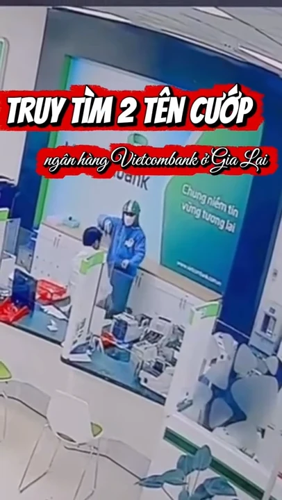 Cầm vật giống súng uy hiếp, 2 tên cướp lấy nhiều cọc tiền ở ngân hàng Vietcombank