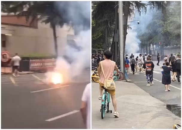 Có người đốt pháo bên ngoài Lãnh sự quán Mỹ ở Thành Đô (Ảnh: Đông Phương).