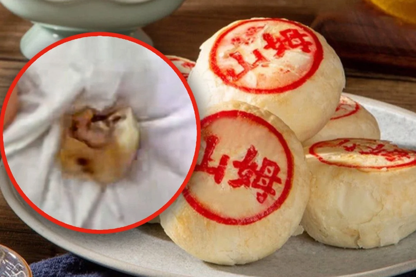 Một chiếc răng người được một phụ nữ Trung Quốc tìm thấy trong chiếc bánh trung thu mua từ chi nhánh đại lục của chuỗi siêu thị Sam's Club của Mỹ (Ảnh: SCMP)