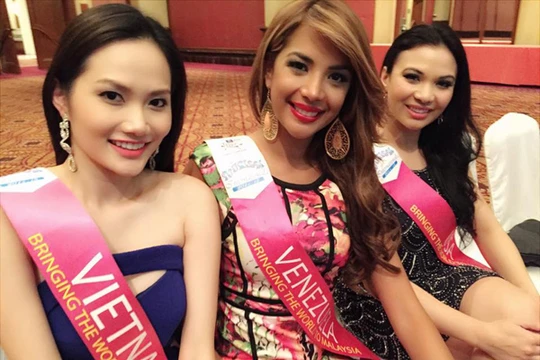 Siêu mẫu Diệu Linh âm thầm đi thi Hoa hậu Du lịch quốc tế 2014.