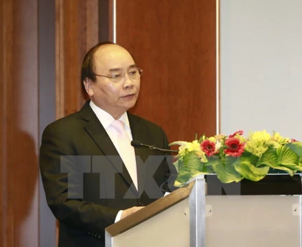 Thủ tướng Nguyễn Xuân Phúc dự Diễn đàn Doanh nghiệp Việt Nam-Đức. Ảnh: TTXVN