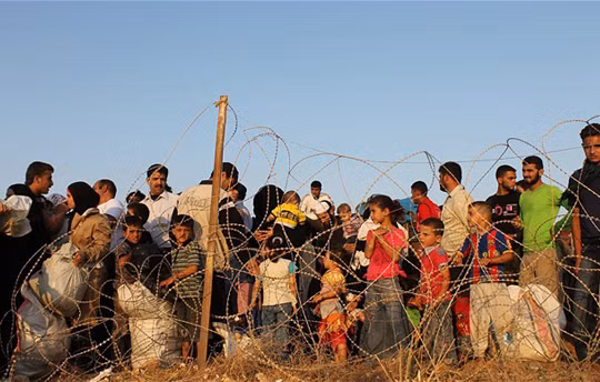 Người tị nạn Syria tại biên giới với Thổ Nhĩ Kỳ ở Hatay. Ảnh: EPA