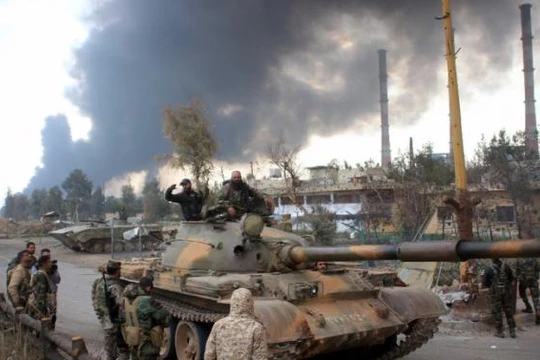 Hồi giáo cực đoan phối hợp với quân đội Syria tấn công IS