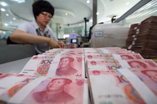 Đồng NDT giảm giá có thể dẫn tới chiến tranh tiền tệ Ảnh: AFP