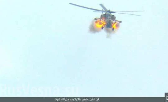 Trực thăng Mi-28 khai hỏa trên sa mạc Palmyra, ảnh từ trang Amaq của IS