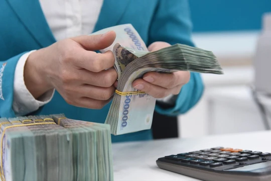 NHNN nới “room” tín dụng lên 14% cho toàn hệ thống ngân hàng