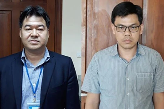 Bị can Nguyễn Hoài Giang (trái) và bị can Phạm Xuân Quang (phải).