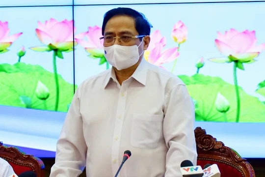 Thủ tưởng Phạm Minh Chính tại cuộc họp với TP.HCM sáng 13/5 -Ảnh Huyền Mai