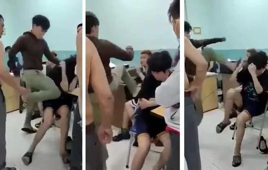 Hai thiếu niên 14 tuổi bị đấm đá dã man tại phòng giám thị Trường THCS Nguyễn Văn Tố, quận 10 (Ảnh cắt từ clip)