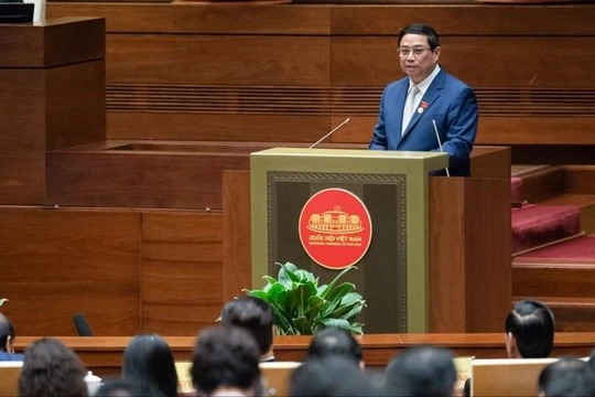 Thủ tướng Phạm Minh Chính báo cáo kết quả thực hiện kế hoạch phát triển kinh tế - xã hội năm 2023 và dự kiến kế hoạch phát triển kinh tế - xã hội năm 2024.