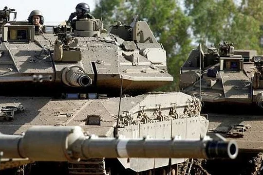 Xe tăng Merkava của Israel hoạt động trên Cao nguyên Golan (Ảnh: AFP)