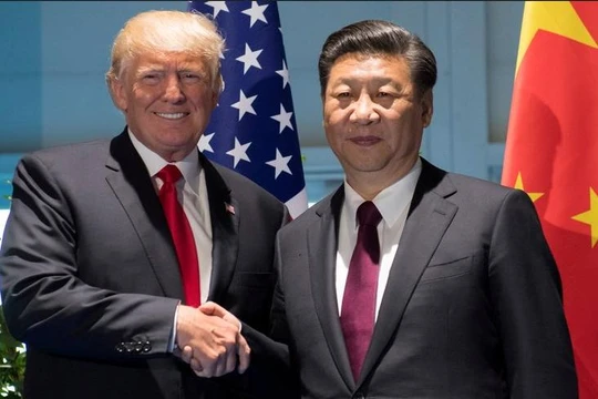 Tổng thống Mỹ Donald Trump và Chủ tịch Trung Quốc Tập Cận Bình bắt tay nhau. Ảnh: Malay Mail Online