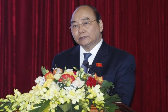 Chủ tịch nước Nguyễn Xuân Phúc, Trưởng Ban Chỉ đạo Cải cách tư pháp Trung ương phát biểu tại hội thảo khoa học.