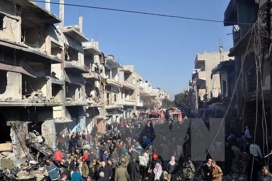 Hiện trường vụ đánh bom xe ở Homs. (Nguồn: AFP/TTXVN)