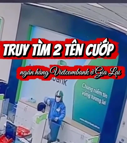 Cầm vật giống súng uy hiếp, 2 tên cướp lấy nhiều cọc tiền ở ngân hàng Vietcombank