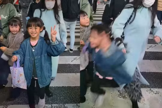 Ảnh chụp màn hình từ một video lan truyền trên mạng xã hội cho thấy bé gái bị xô ngã tại ngã tư Shibuya nổi tiếng ở Tokyo, Nhật Bản. Ảnh: Instagram.