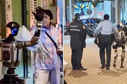 Một người máy hình người được cảnh sát hộ tống trên đường phố Macau, Trung Quốc. Ảnh: IE.