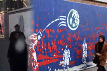 Người dân đi ngang qua những bức tranh tường có nội dung phản đối Mỹ ở Tehran, Iran. Ảnh: Getty.