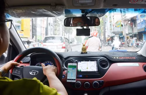 Xe Grab đang được thí điểm là xe hợp đồng điện tử