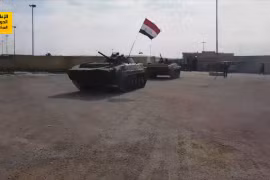 Một xe thiết giáp của quân đội Syria trên tiền đồn của người Kurd - ảnh minh họa Masdar 