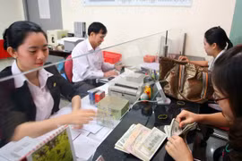 Thị giá cổ phiếu tổ chức tín dụng phản ánh cả những chuyển động bề nổi cũng như chuyển động phía sau của hoạt động ngân hàng. Ảnh minh họa Lê Toàn.