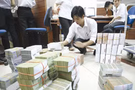 Ngân hàng Nhà nước đã chủ động bổ sung quy định nhằm hỗ trợ các tổ chức tín dụng giảm bớt khó khăn trong công tác trích lập dự phòng rủi ro hàng năm. Ảnh: TUỆ DOANH