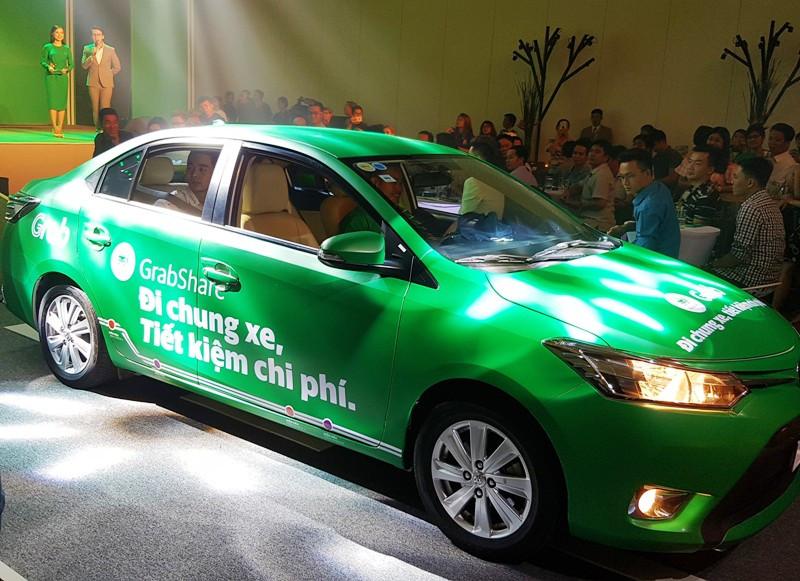 “Đại chiến” taxi: Grab, Uber chiếm lĩnh thị trường ra sao sau 2 năm thí điểm? ảnh 1