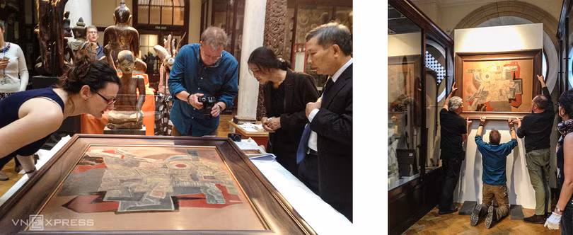 Các chuyên gia thẩm định và treo tranh tại MAA dưới sự chứng kiến của các chuyên gia hai nước. Ảnh tư liệu: VNFAM.