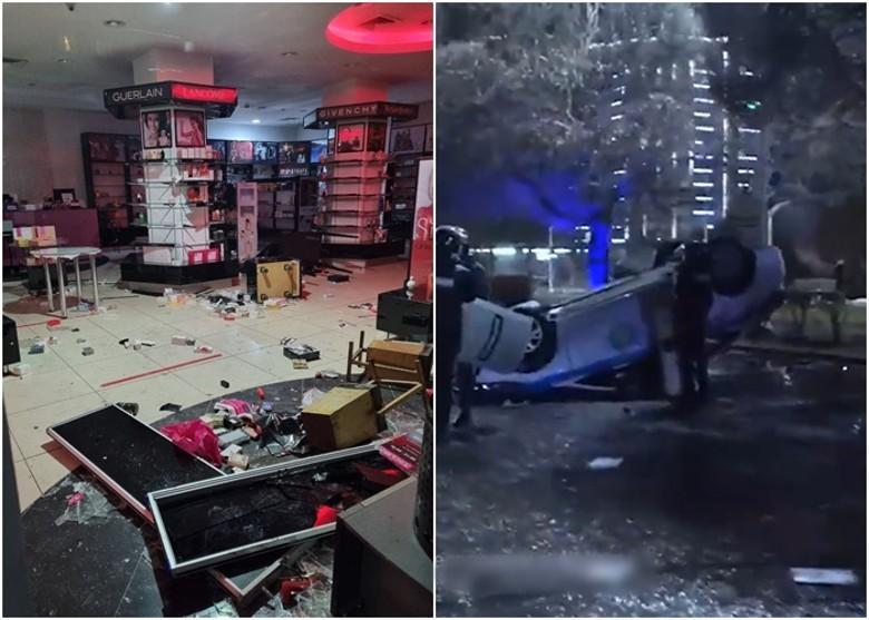 Các cửa hiệu bị người biểu tình cướp phá (Ảnh: Đông Phương).