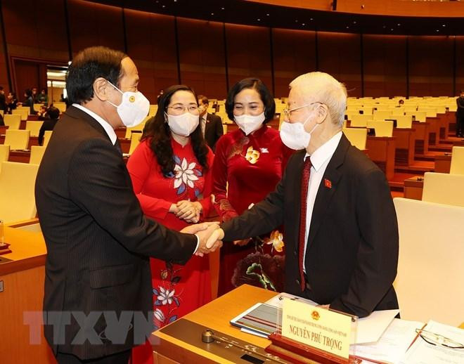 Tổng Bí thư Nguyễn Phú Trọng với Phó Thủ tướng Lê Văn Thành tại phiên khai mạc. (Ảnh: Trí Dũng/TTXVN)