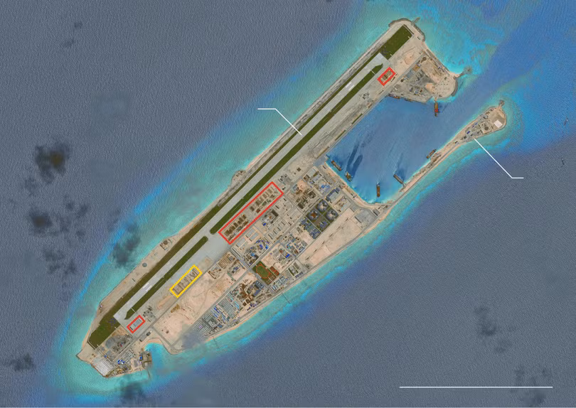 Đá Chữ Thập sau khi được cải tạo thành đảo nhân tạo có diện tích lớn nhất Trường Sa với một đường băng dài 3km và các nhà chứa máy bay