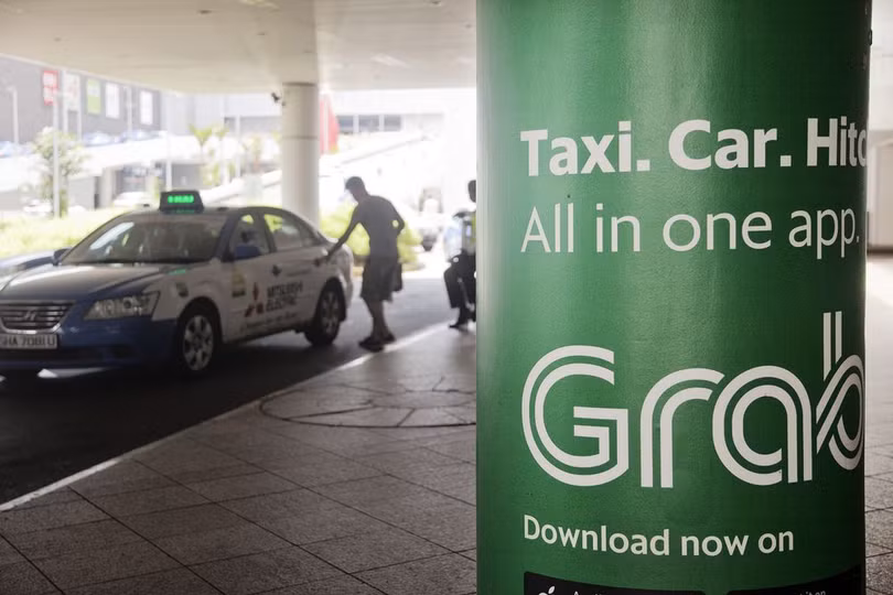 Grab sắp thâu tóm xong Uber Đông Nam Á (ảnh Bloomberg)