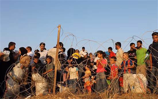 Người tị nạn Syria tại biên giới với Thổ Nhĩ Kỳ ở Hatay. Ảnh: EPA