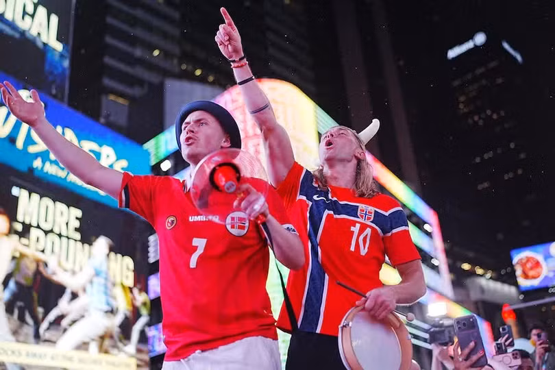 ole-frystad-right-leads-the-viking-row-in-times-square.jpg