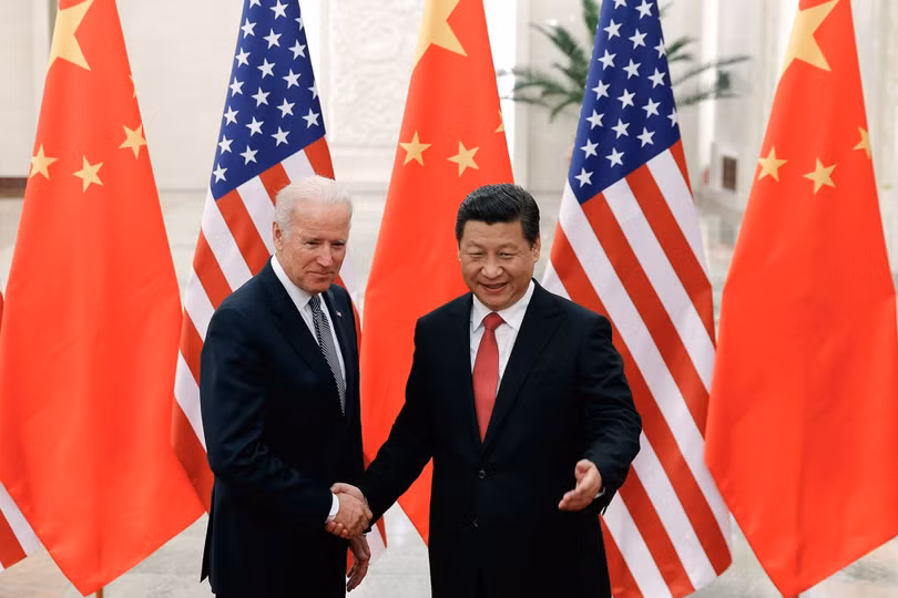Chủ tịch Trung Quốc Tập Cận Bình và Phó Tổng thống Mỹ Joe Biden gặp gỡ trong năm 2013 (Ảnh: TNS)