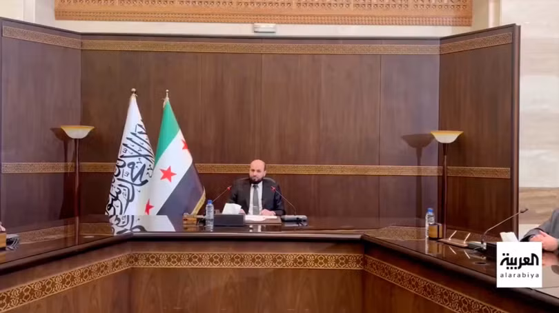 Thủ tướng tạm quyền Syria Mohamed al-Bashir tham dự cuộc họp với nội các chuyển tiếp. Ảnh: Reuters.