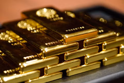 Giá vàng thế giới sáng 1/10 giảm xuống 4.154 USD/ounce, thấp hơn khoảng 19 USD/ounce so với sáng 30/9. Ảnh: Bloomberg.