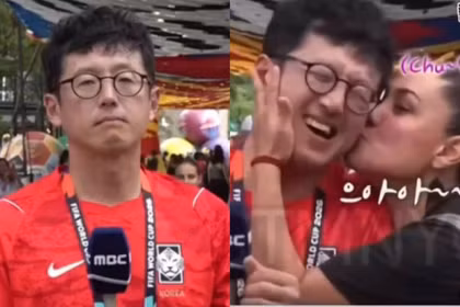 Phóng viên Son Jang-hoon đang tác nghiệp và bị...cưỡng hôn. Ảnh: LTN.