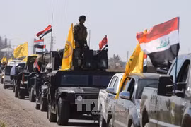 Lực lượng an ninh Iraq tiến vào Tikrit trong chiến dịch tấn công các phần tử IS ngày 28/2. Ảnh: AFP-TTXVN