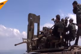 Lực lượng Hồi giáo cực đoan sẵn sàng cho cuộc chiến với quân đội Syria ở Lattakia. Ảnh minh họa video Sputnik.
